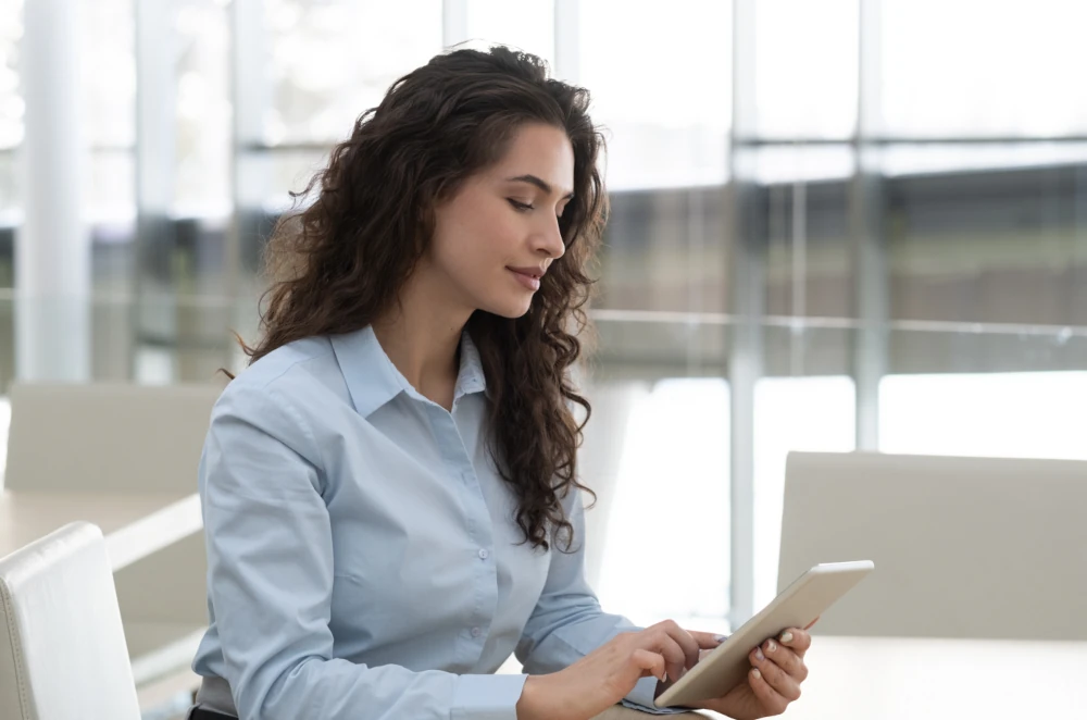 Photo: manager using a tablet.